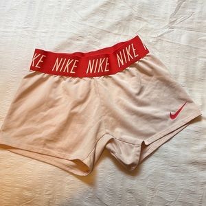 Girls Nike Dri-Fit shorts. Size small in girls.Pinkish coral color.